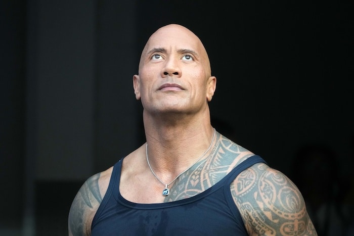 American actor Dwayne Johnson attends the game
