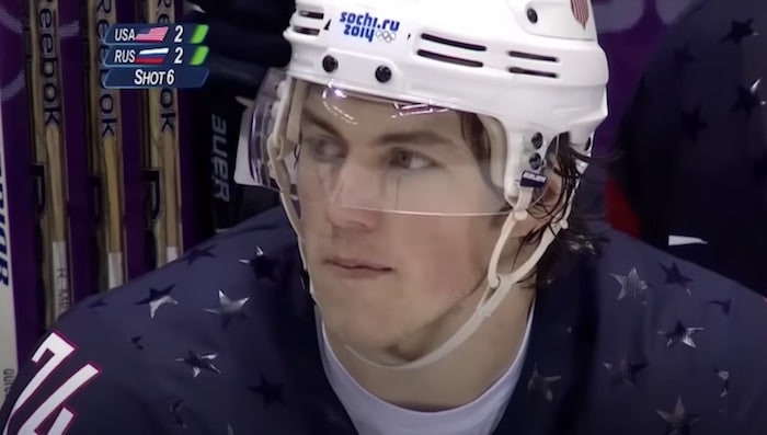 T.J. Oshie sits on a bench.