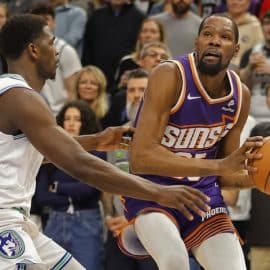 Phoenix Suns forward Kevin Durant (35) looks to the basket as Minnesota Timberwolves guard Anthony Edwards (5)