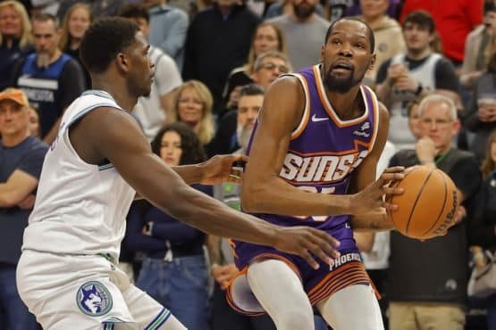 Phoenix Suns forward Kevin Durant (35) looks to the basket as Minnesota Timberwolves guard Anthony Edwards (5)