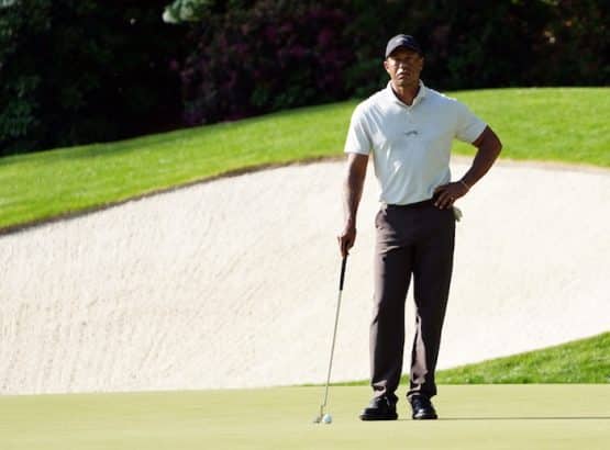 Tiger Woods waits to putt on no. 13 during a practice round for the Masters Tournament