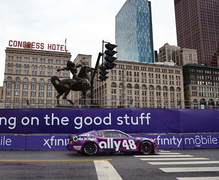 Alex Bowman rides in frtont of statue (1)